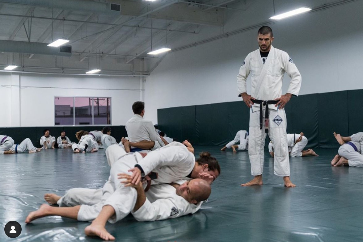 Rener Gracie looking over Jiu Jitsu sparring session