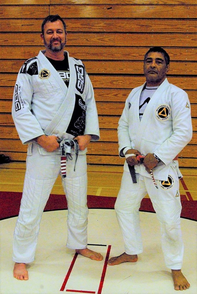 Matt Thornton receives his blue belt from the legendary Rixon Gracie